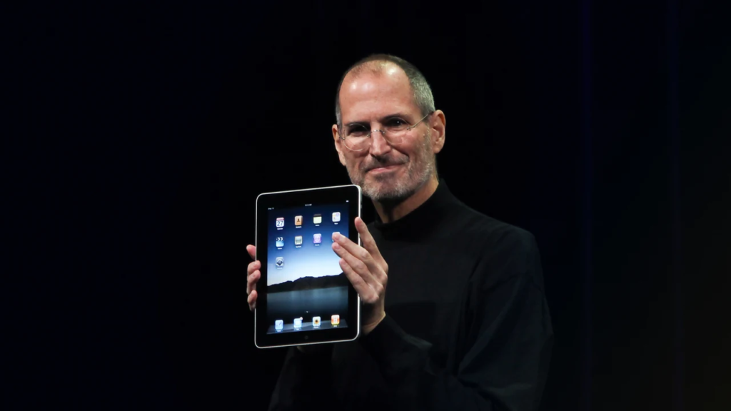 Steve Jobs showing off iPad
